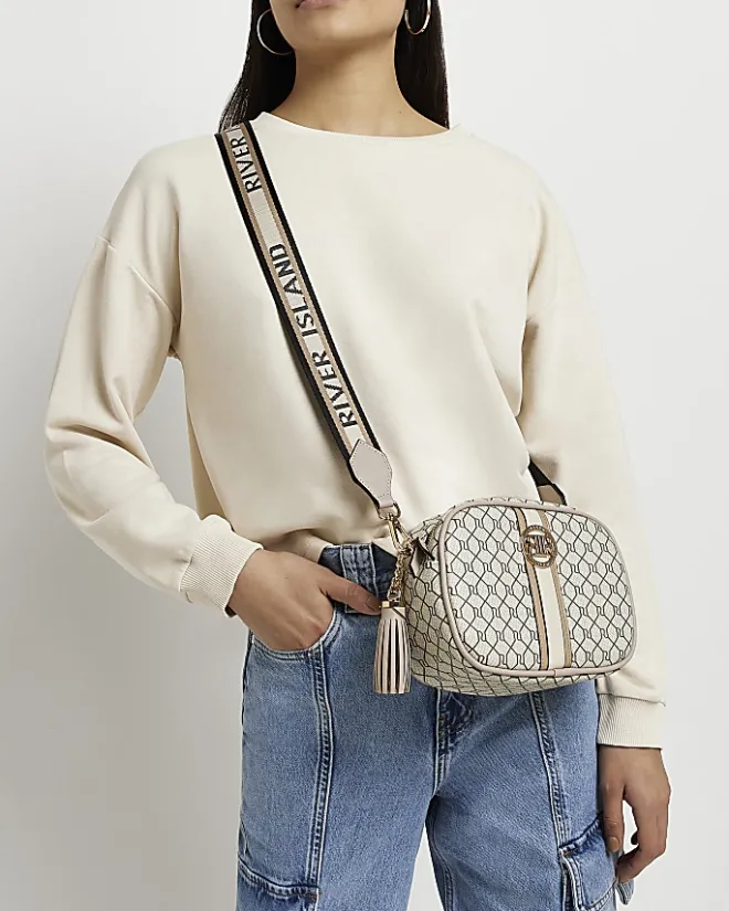 River Island Beige RI monogram print cross body bag Cream Hot