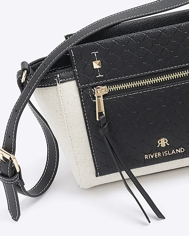 River Island canvas embossed RI cross body bag Black Sale