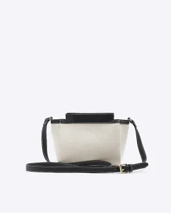 River Island canvas embossed RI cross body bag Black Sale
