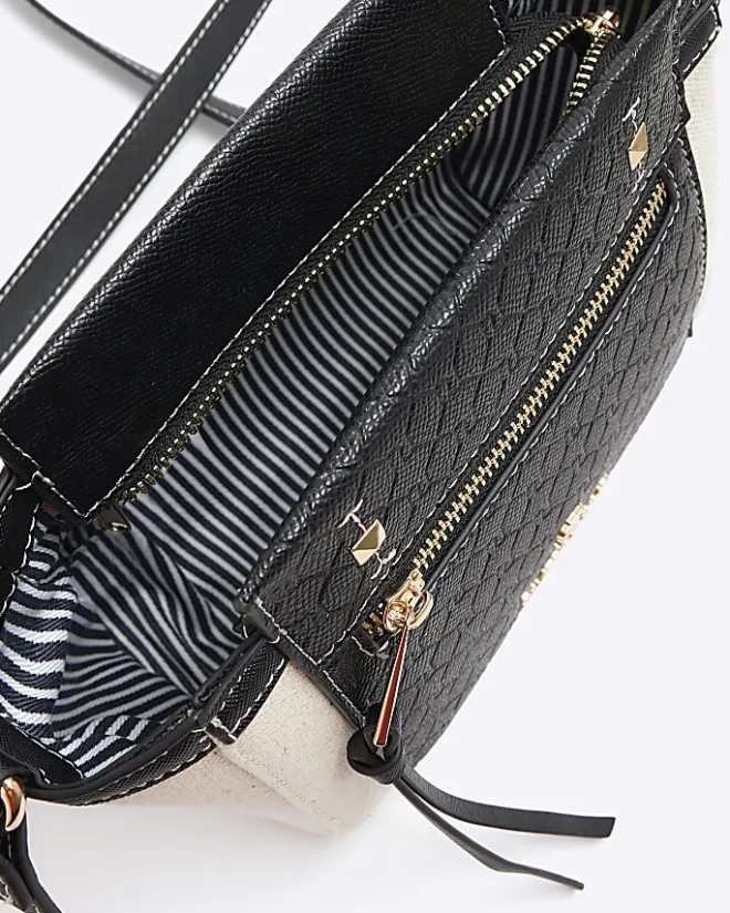 River Island canvas embossed RI cross body bag Black Sale