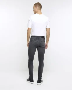 River Island spray on super skinny fit ripped jeans Black Fashion
