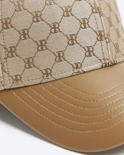 River Island RI monogram cap Brown Online