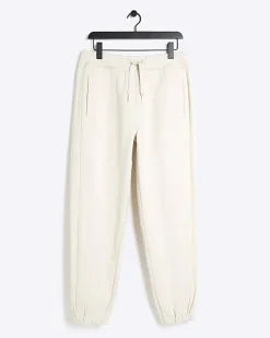 River Island Ecru regular fit rib panel joggers Stone Online