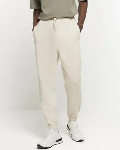 River Island Ecru regular fit rib panel joggers Stone Online