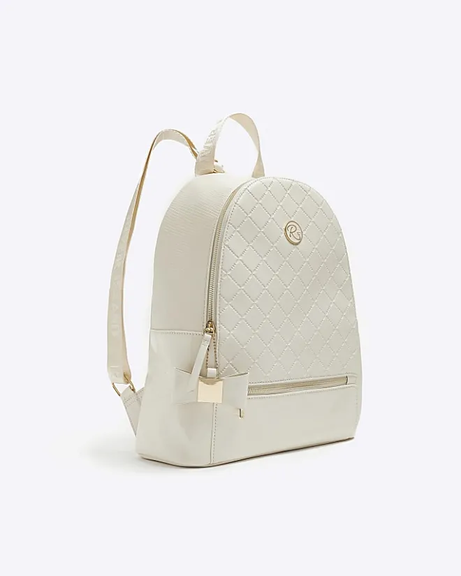 River Island Girls quilted bow detail backpack Cream Online