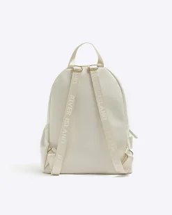 River Island Girls quilted bow detail backpack Cream Online