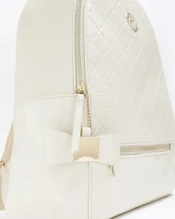 River Island Girls quilted bow detail backpack Cream Online