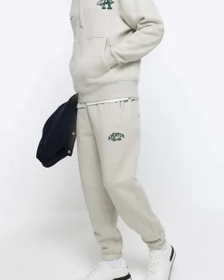 River Island regular fit graphic cuffed joggers Grey Sale