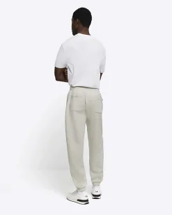 River Island regular fit graphic cuffed joggers Grey Sale