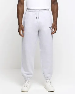 River Island regular fit graphic tracksuit joggers Grey Online