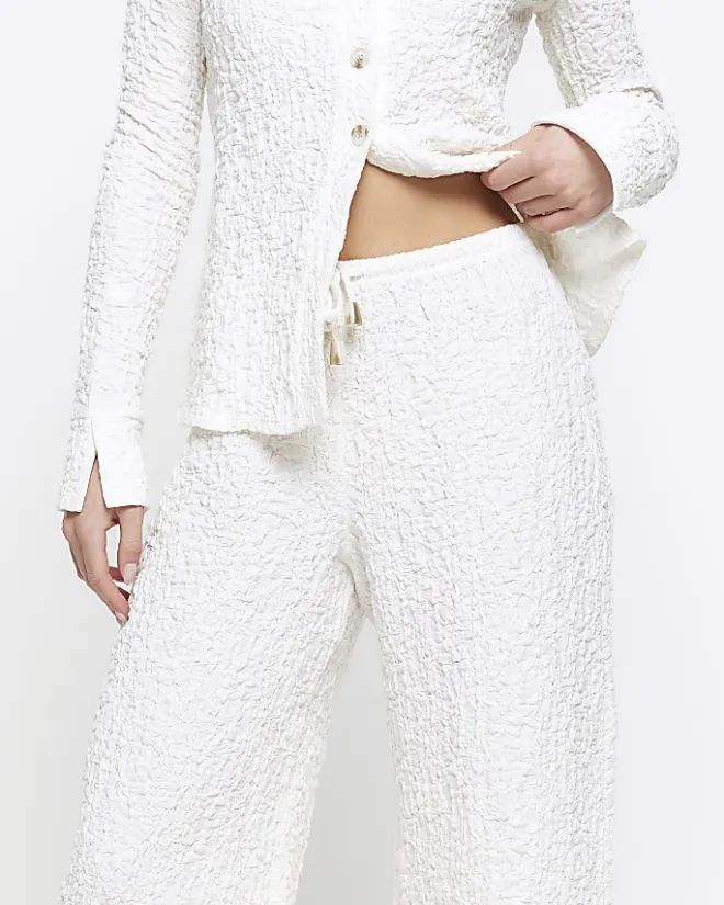 River Island Petite textured wide leg trousers Cream Online