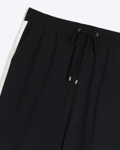 River Island Plus side stripe wide leg joggers Black Outlet